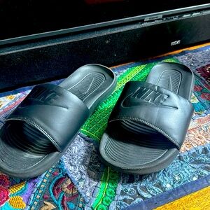 Black Nike slides